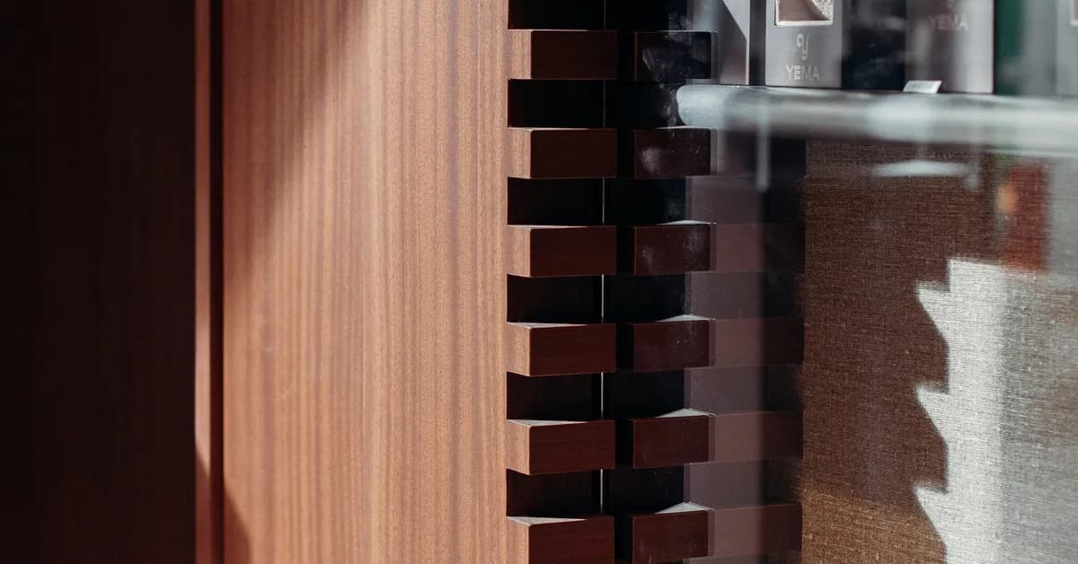 Paris watchmaker boutique reflects mechanical heritage with Shinnoki's wood panels