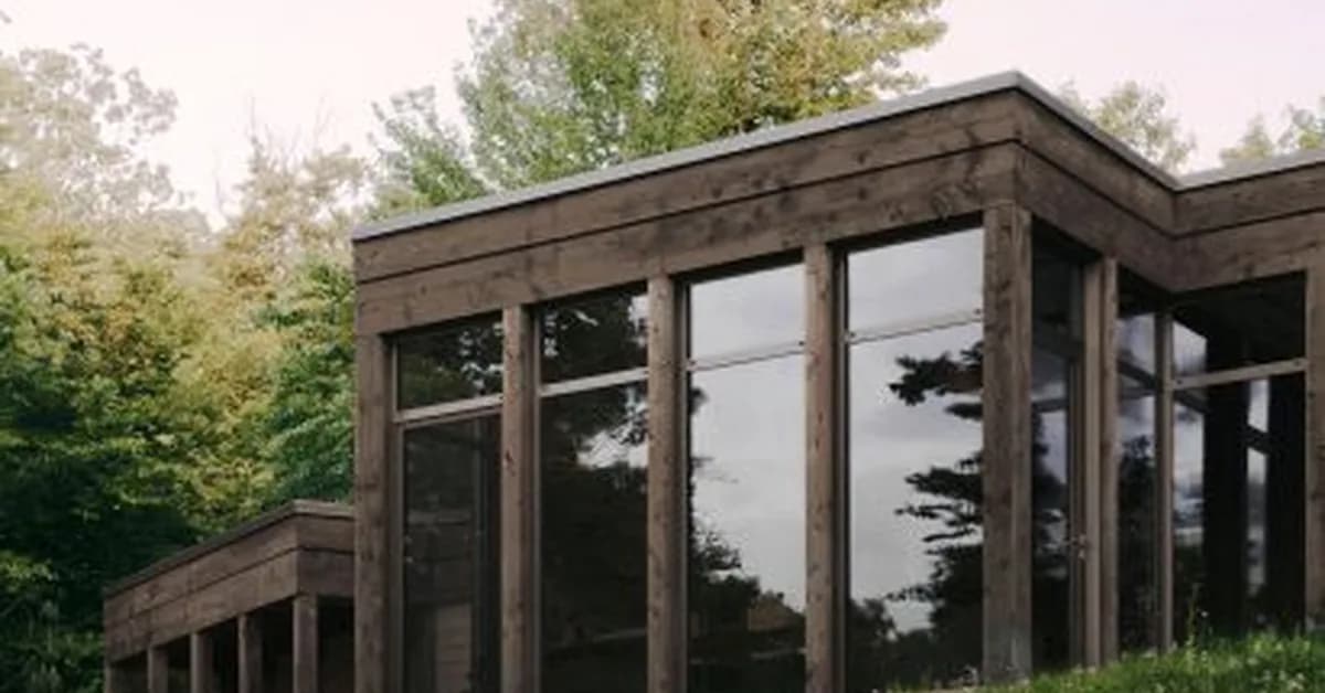 Atelier Carle creates "unconventional layout" for hemlock-clad Quebec house