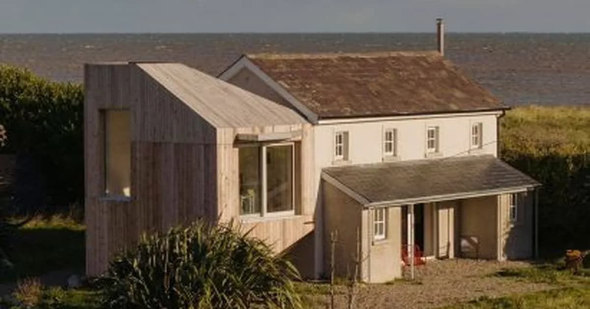 Timber bird hides inform Irish cottage extension by Architectural Farm