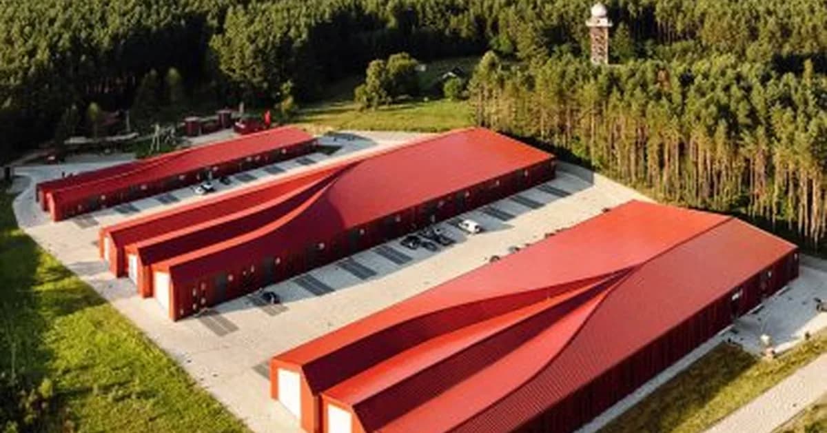 Sweeping roofs top bright red logistics hub in Ukraine by Aranchii Architects