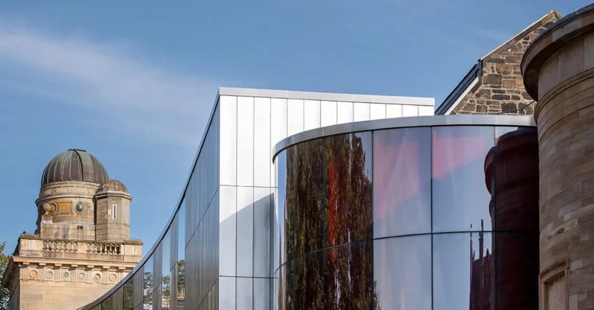 AL_A adds red glass entrance and panoramic extension to Paisley Museum