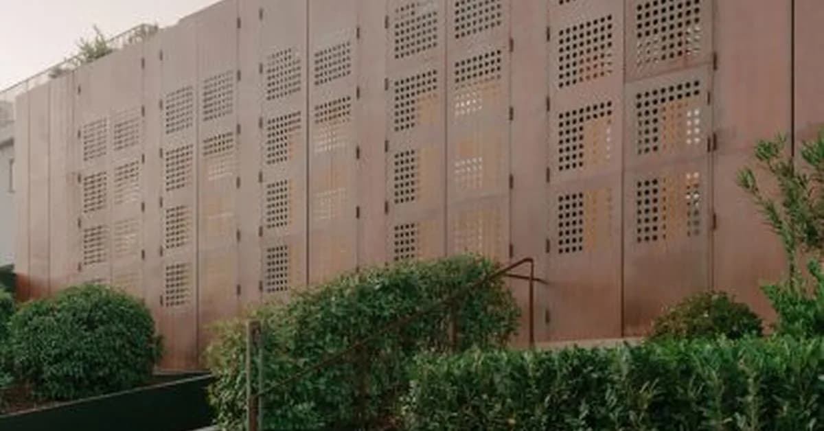 TIMM Architecture fronts House of Iron Doors with weathered steel shutters