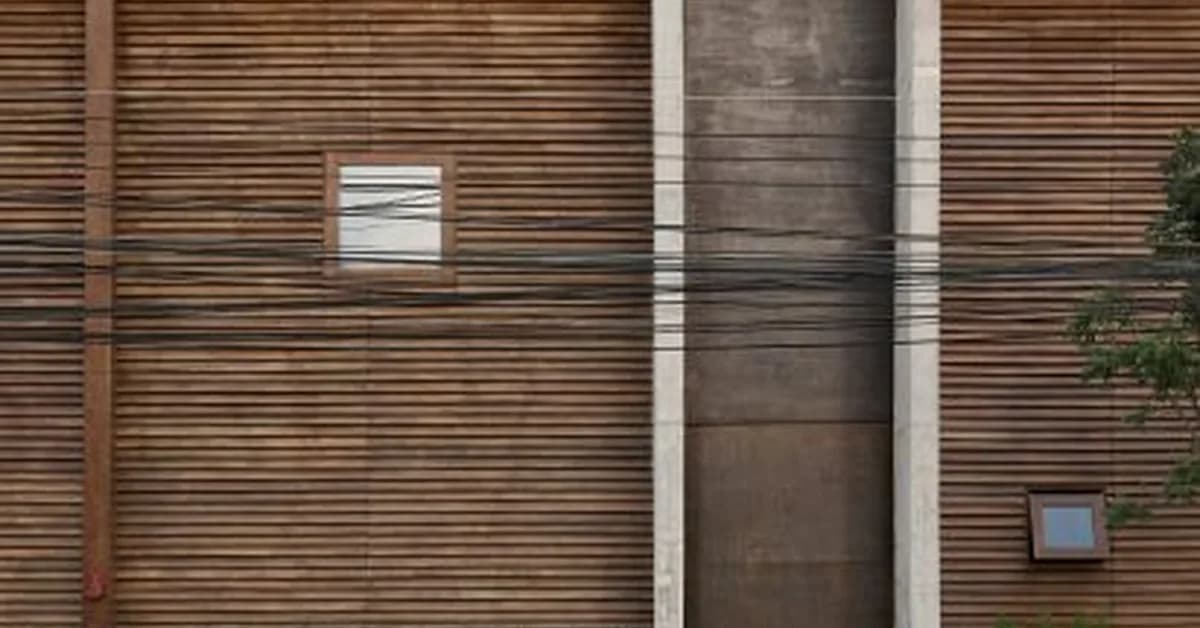Breezy louvre walls enclose restaurant in Thailand by Studio Locomotive